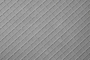 Texture of geometric pattern on metallic surface.