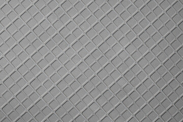 Texture of geometric pattern on metallic surface.