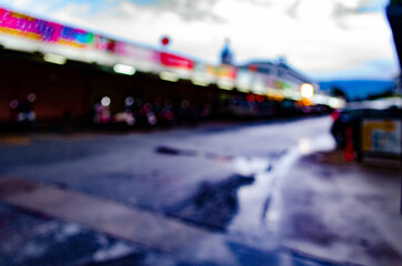 The abstract blur of night market atmosphere in the evening with no shops during the coronavirus outbreak.