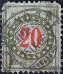 Switzerland - Circa 1878: a postage stamp printed in the Switzerland showing a circle with stars...