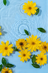 Water ripple with yellow  flowers. Trendy  background for cosmetic product presentation. Artistic concept. Copy space