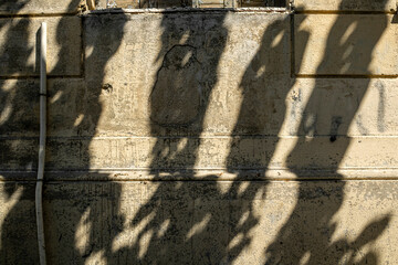 Old stone wall with shadows 