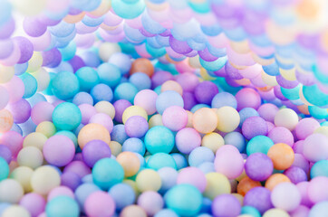 Fototapeta na wymiar Foam beads of various colors brightly colored.