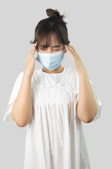 Asian woman wearing mask to protect herself from COVID-19