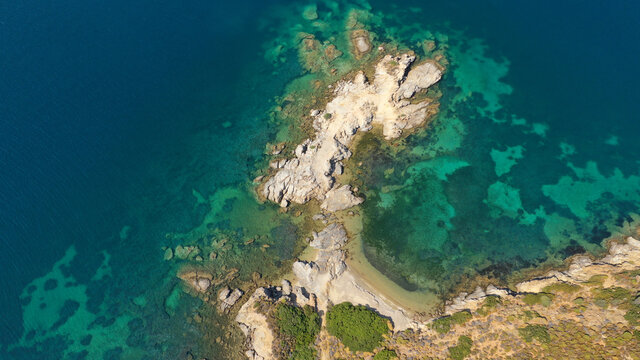 Aerial drone photo of tropical exotic paradise rocky bay with deep turquoise sea forming a blue lagoon © aerial-drone