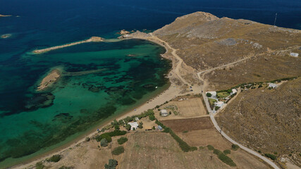 Aerial drone photo of small secluded bay and sandy beach of Achilli featuring small chapel of Agios Nikolaos in Sporadic Aegean island of Skyros, Greece