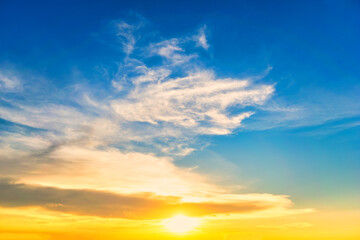 Fototapeta premium Sky blue and orange light of the sun through the clouds in the sky