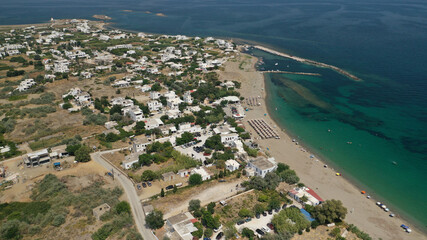 Aerial drone photo of small harbour of Molos a traditional boat safe anchorage near popular beach...