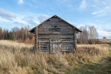 Old house. Wooden barn. The tract.