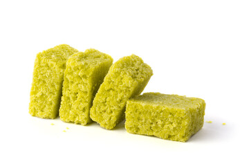 coconut toffees, sugary snack isolated on white background, closeup view