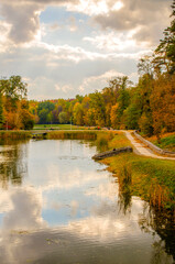 Picturesque autumn park overlooking the pond