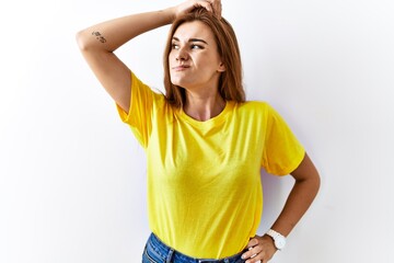 Young brunette woman standing over isolated background confuse and wondering about question....
