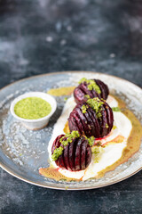 Hasselback roast beetroot with yogurt and herb sauce