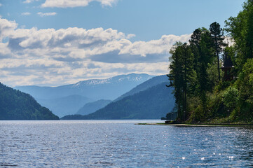 View of lake Teletskoye and the surrounding mountains from the village of Artybash. Turochaksky...