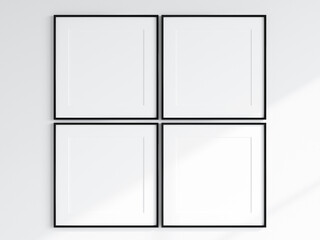 four black square frames on the white wall, gallery frame mockup
