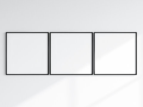 three black square frames on the white wall, gallery frame mockup