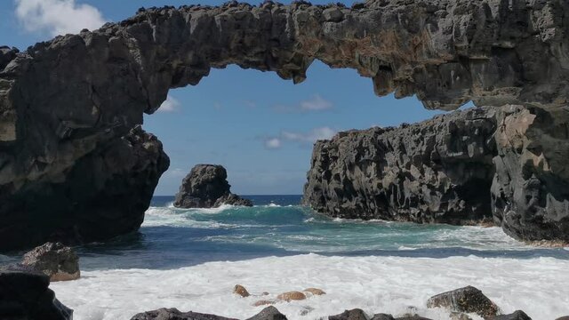rocky beach with a natural arch in Las Puntas. El Hierro island. Canary Islands