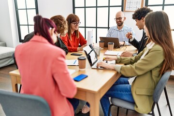 Group of business workers smiling happy working at the office.