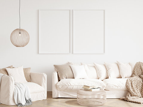 modern living room interior mockup with two white frames on the wall © vnmockup
