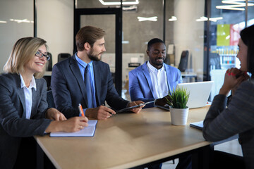 Job interview with the employer, businessman listen to candidate answers.