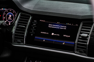 Modern car media display in the interior of the car. Touchscreen monitor on the dashboard of the modern car.