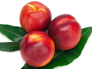 Peaches fruit with leaves isolated on white background