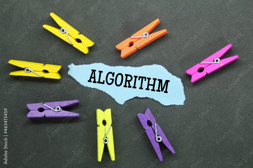 Poster colored wooden clamps, torn paper with the word algorithm