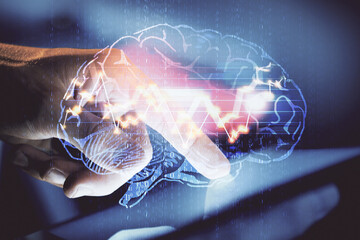 Double exposure of man's hand holding and using a digital device and brain hologram drawing. Data...