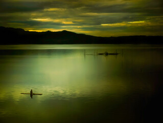 Fisher in Darma lake sunrise