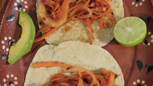 Vegan Mexican tinga taco on traditional clay plate