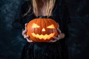 european redhead woman in make-up, costume of the witch in the style of the spanish day of the dead...