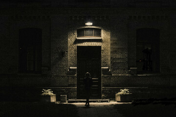 Beautiful girl in front of the night building 