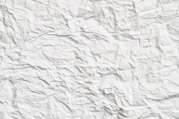 White crumpled paper texture with wrinkles. Damaged and torn sheet