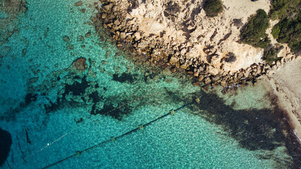 Fototapeta na wymiar Beautiful birdsview with a drone on the beach, rocks, sand, sea and waves.