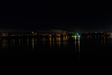 Night view of the Dnieper river and Dnipro city in Ukraine