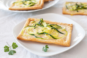 Pizza with zucchini and vegetable cheese. Vegan appetizer