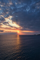 Beautiful sunset with a dramatic sky and clouds over the sea