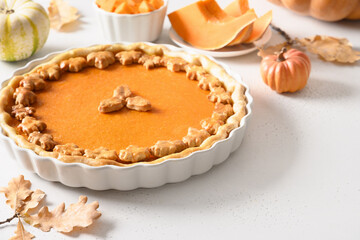 Traditional American Pumpkin Pie on white background for Thanksgiving Day. Festive seasonal food. Close up. Copy space.