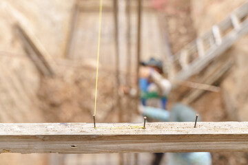 Asian worker working with ground leveling