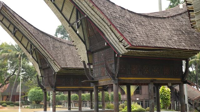 A Tongkonan Traditional ancestral House of South Sulawesi, Indonesia. Boat shaped house with a saddleback roof.