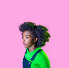 Studio portrait young black woman looking over positive and contemplative daydreaming isolated advertising copyspace background