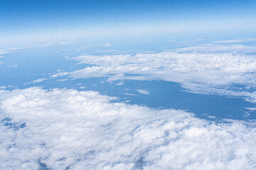white clouds in a blue sky, top view
