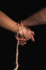 The bound hand of a man and a woman - obrazy, fototapety, plakaty