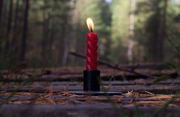 A mysterious candle on a wooden path