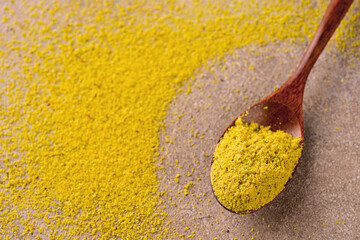 Pistachio gluten free flour in a wooden bowl.