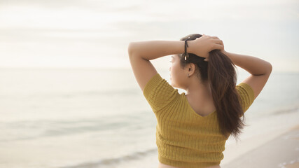 Healthy and happy woman raising her hands on blurry background
Style concept of freedom