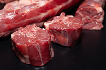 Pieces of turkey neck with bone. Organic turkey meat with greens