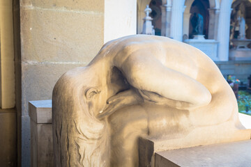 Statue on an old tomb - beginning of 1800, marble - located in Genoa cemetery, Italy