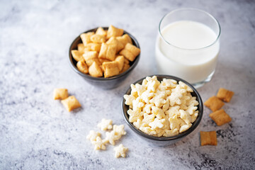 Dried wheat stars and pads for breakfast in a bowl.