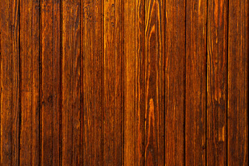 Obraz premium Vintage brown wood background texture with knots and nail holes.Vintage wooden dark horizontal boards.